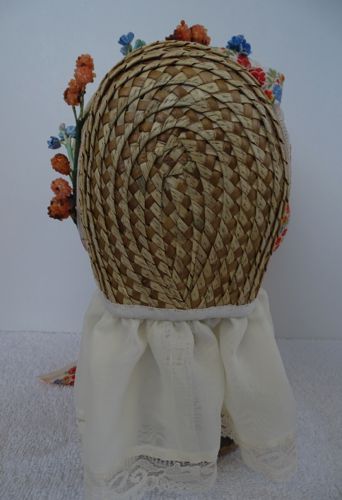 The straw braid was stitched by machine to make this bonnet more affordable.